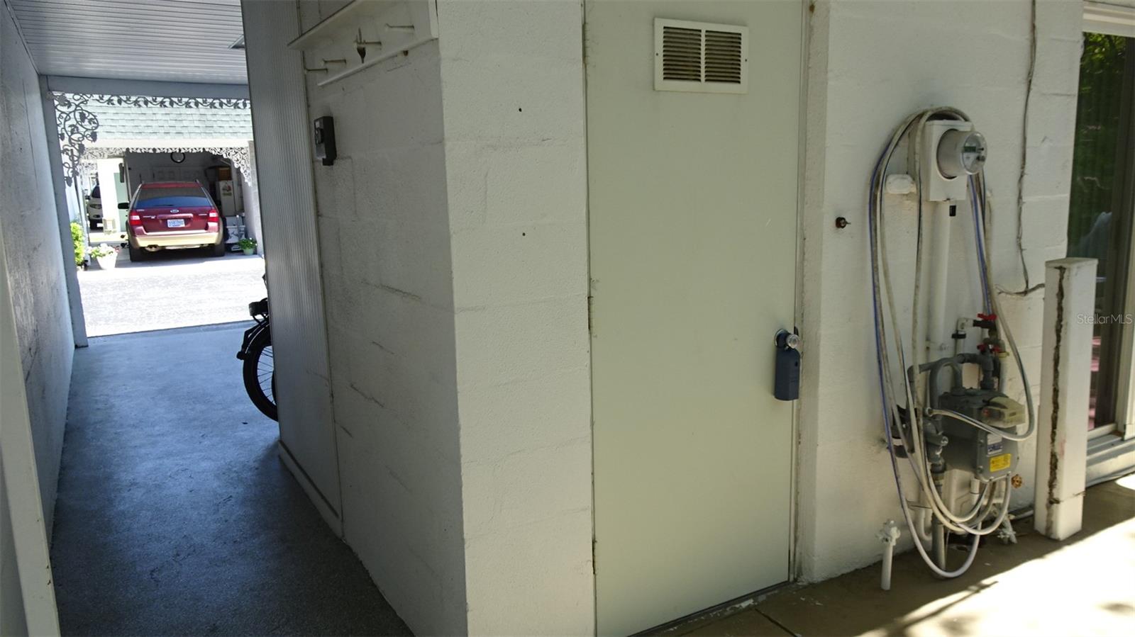 Laundry room behind the carport.