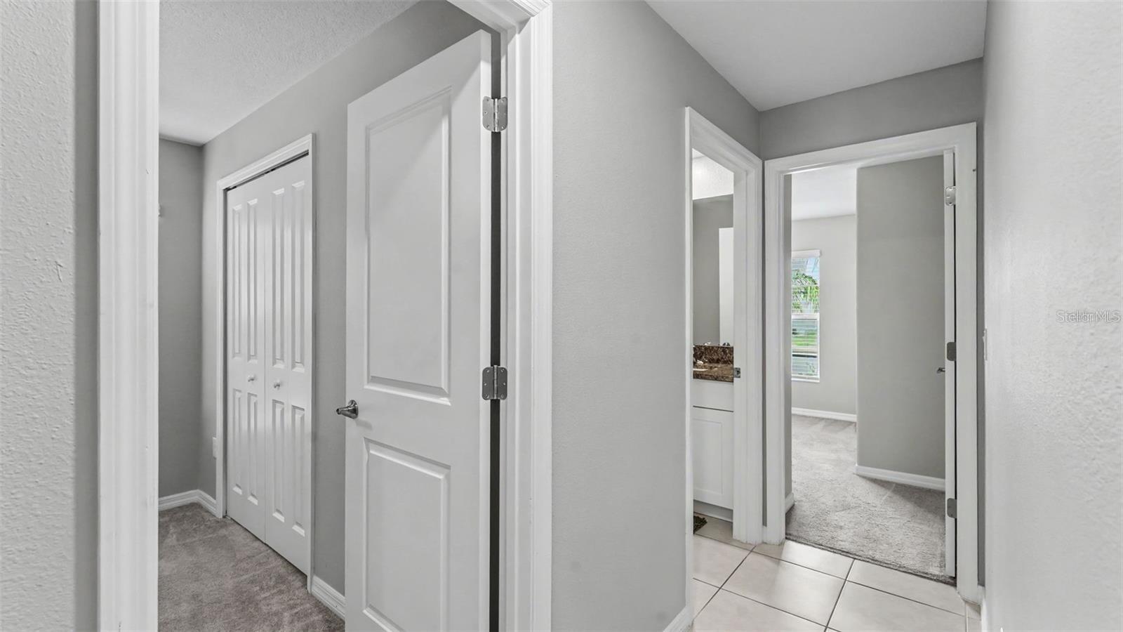HALLWAY TO THREE BEDROOMS - SPLIT PLAN