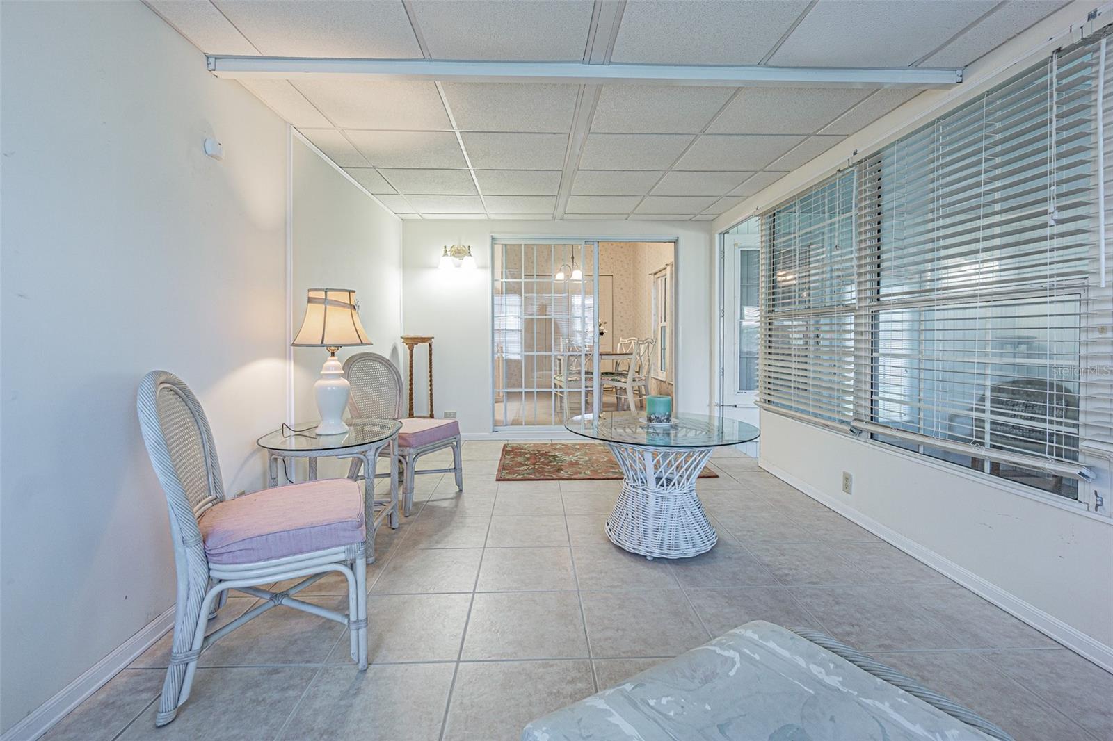 Ceramic tile floors and wall AC in Florida room