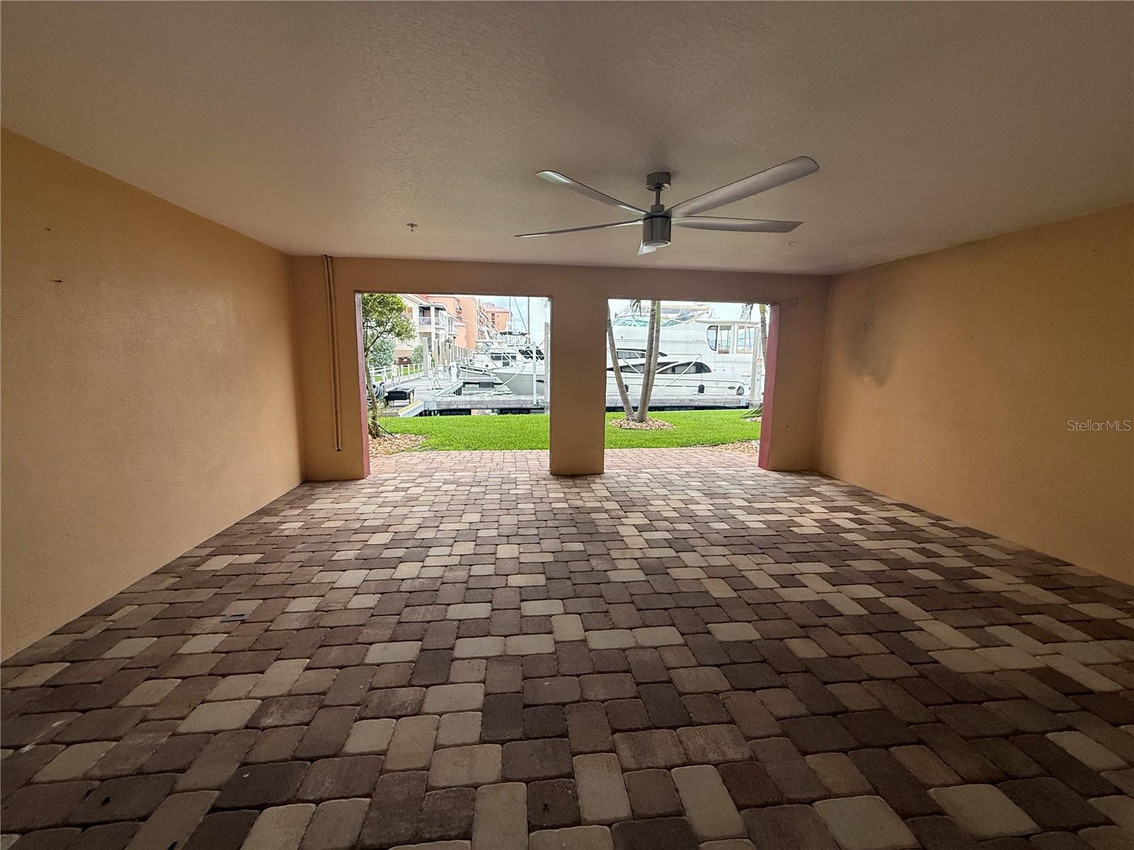 Covered Patio Facing the Water in the Rear of the