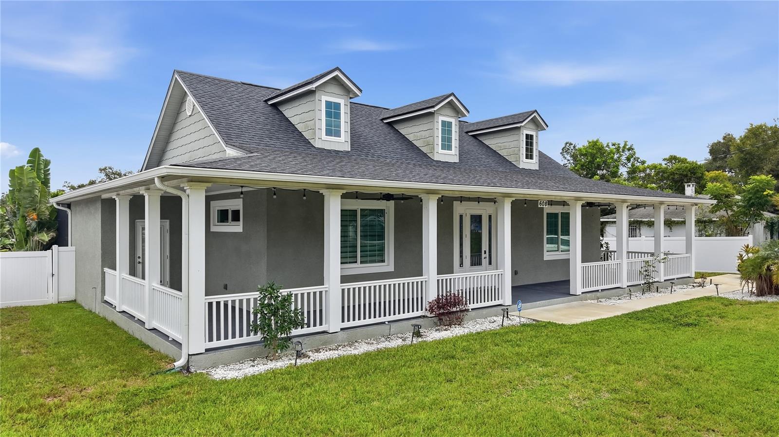 Front of home with 1,100 sq ft wrap around porch Front of home with 1,100 sq ft wrap around porch