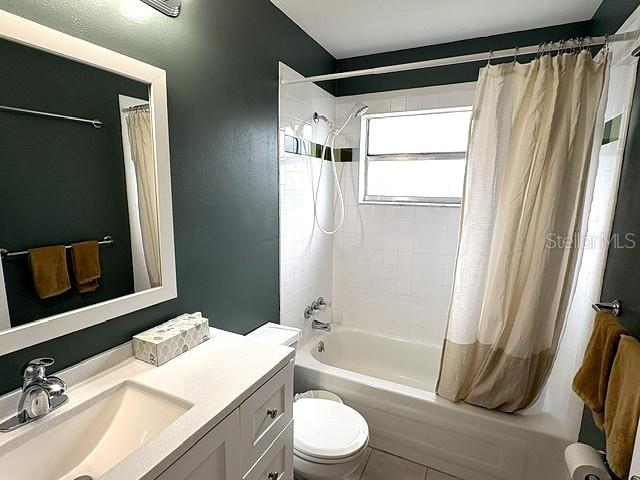 Guest bath with tub shower combo, clean and pretty.