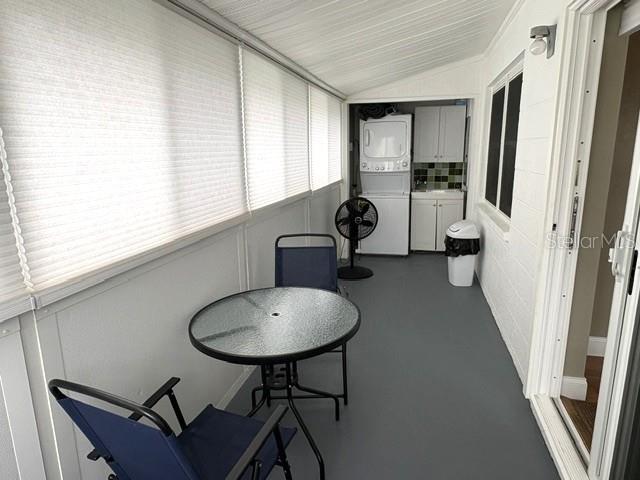 Enclosed lanai with beautiful light filtering shades.