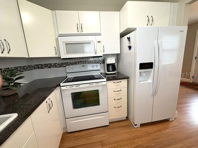 Pretty tile backsplash gives this kitchen a nice updated look.