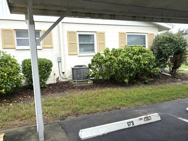 Covered parking is convenient to both front and back doors of home.