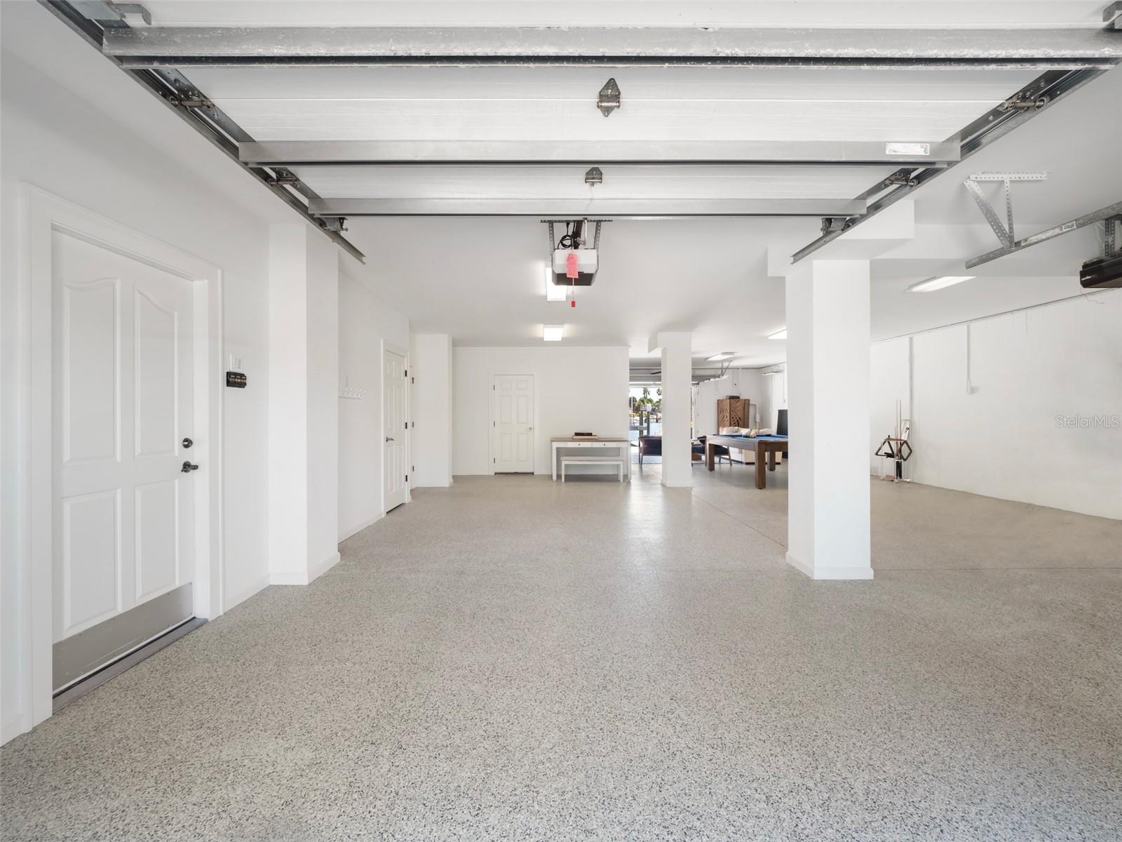 Split car garage accommodates cars, golf carts, beach toys
