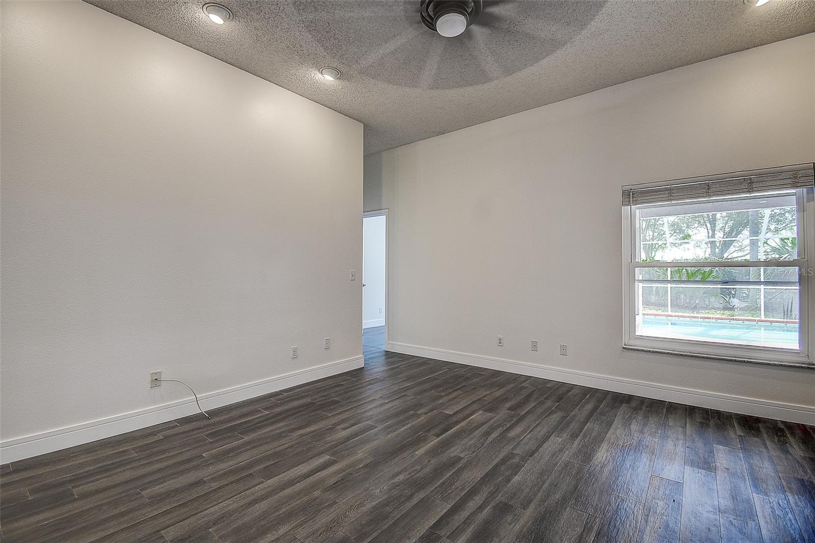 Family Room leading to the pool and Primary Bedrooms