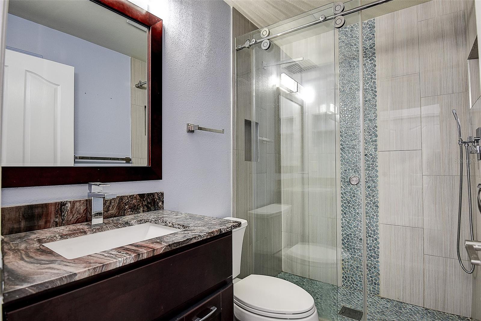 2nd Bath with granite, all wood cabinets and glass shower