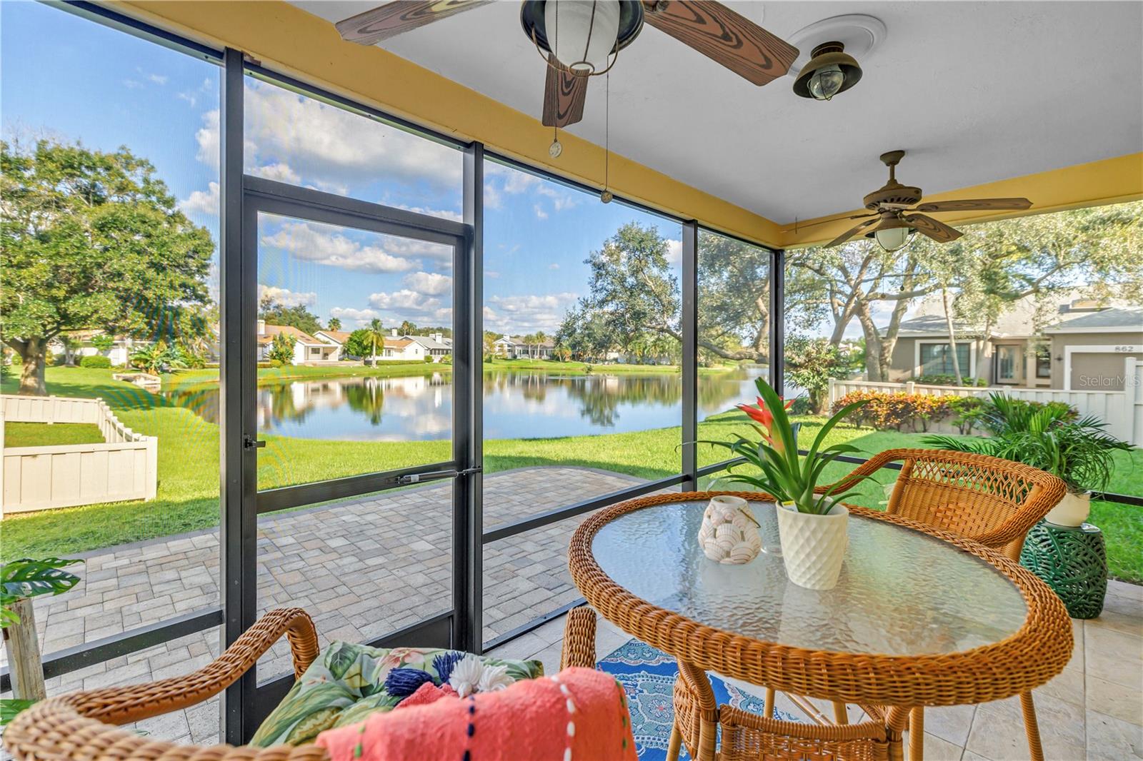 This covered, screened patio provides an ideal setting for enjoying scenic lake views and local wildlife, whether you are relaxing with a beverage or entertaining guests.