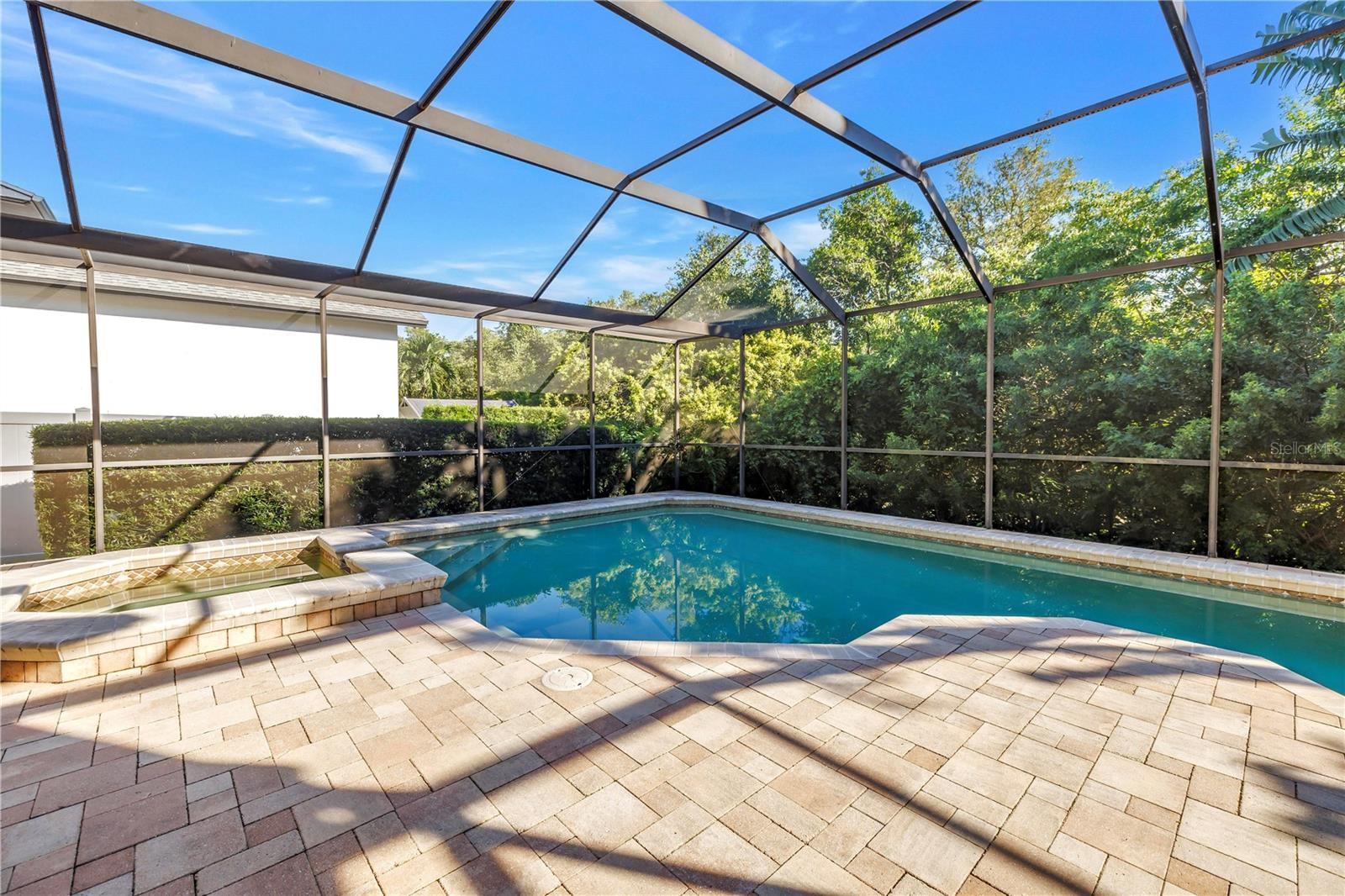 This beautifully designed paver pool deck is engineered to stay cool during the summer and warm in the winter, providing year-round comfort for outdoor relaxation. This beautifully designed paver pool deck is engineered to stay cool during the summer and warm in the winter, providing year-round comfort for outdoor relaxation.