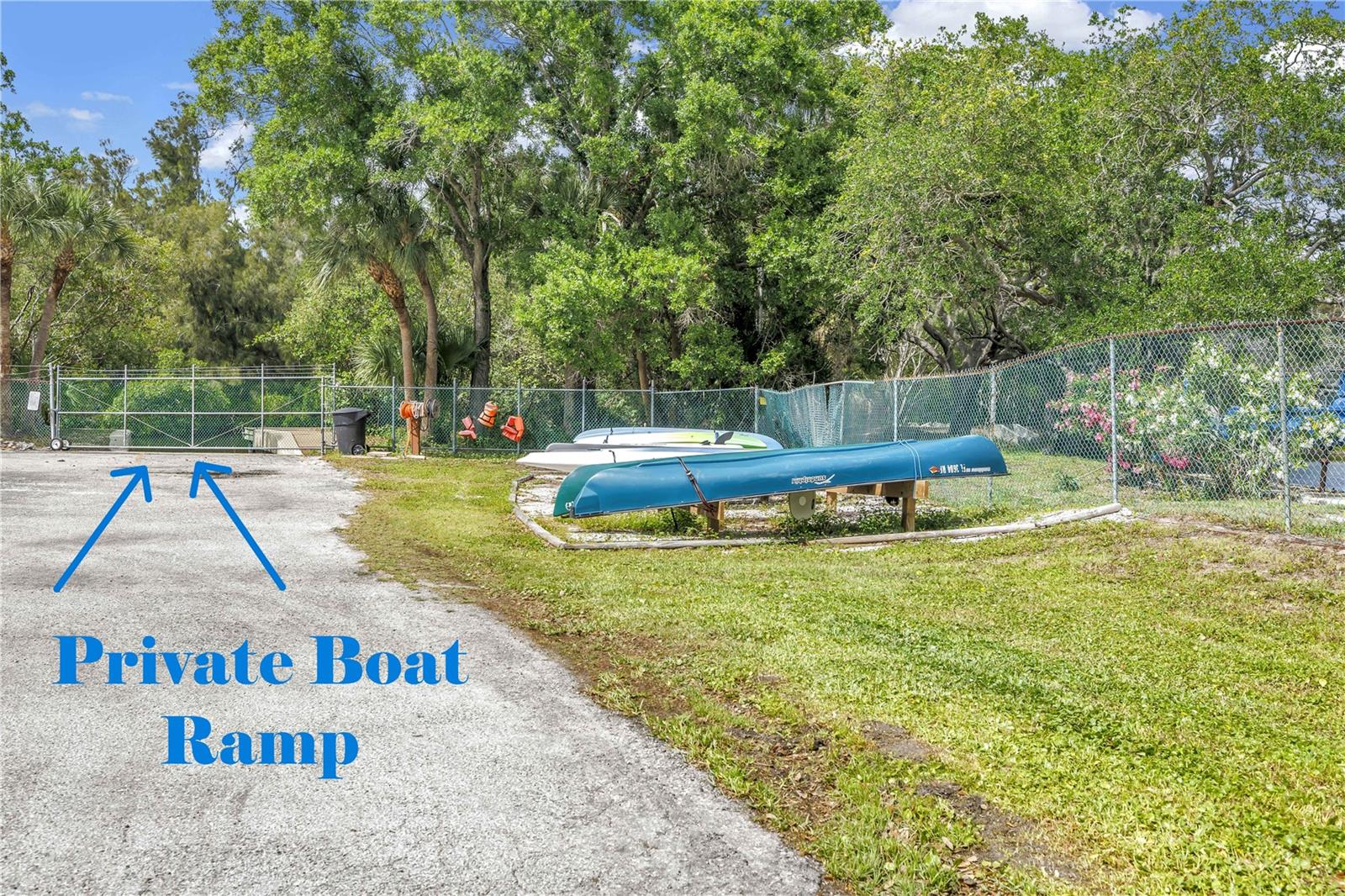 Private boat ramp and dock access exclusively for Caya Costa homeowners, featuring convenient paddleboard and kayak storage areas.