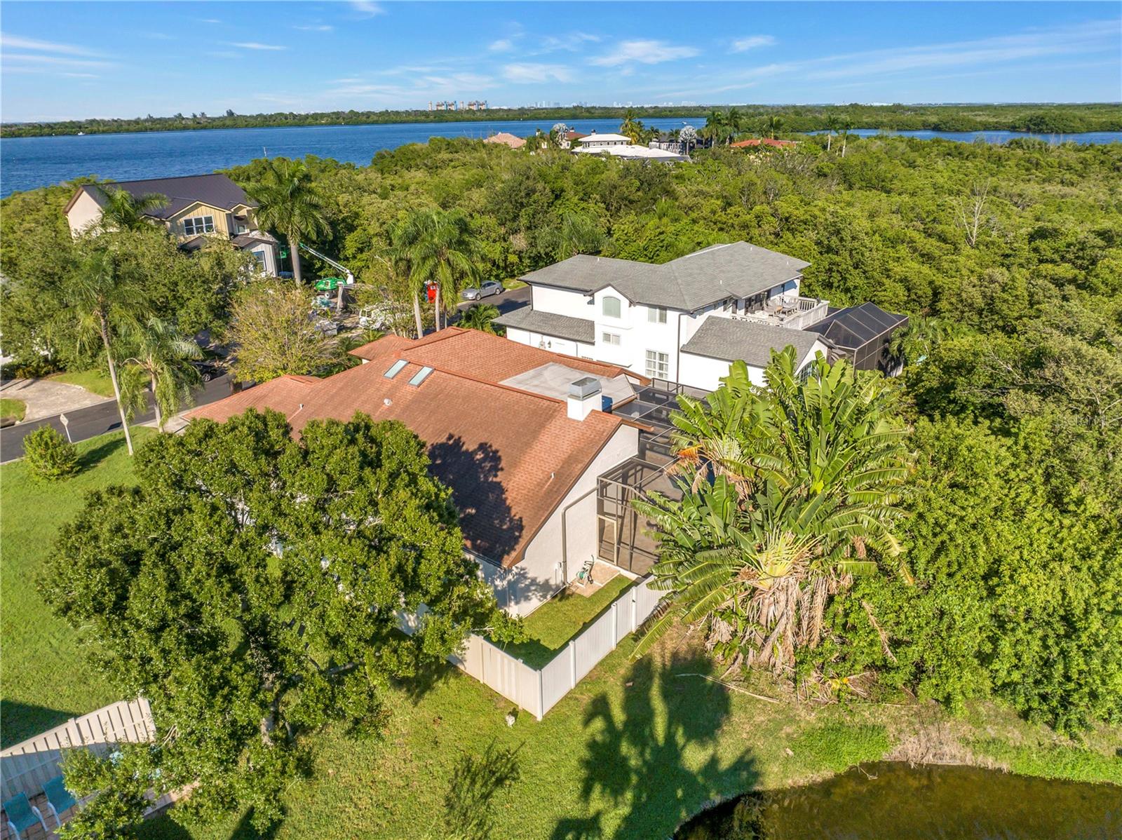 The back corner of the lot features a scenic view of a neighborhood pond, currently enclosed by a private fence. The back corner of the lot features a scenic view of a neighborhood pond, currently enclosed by a private fence.