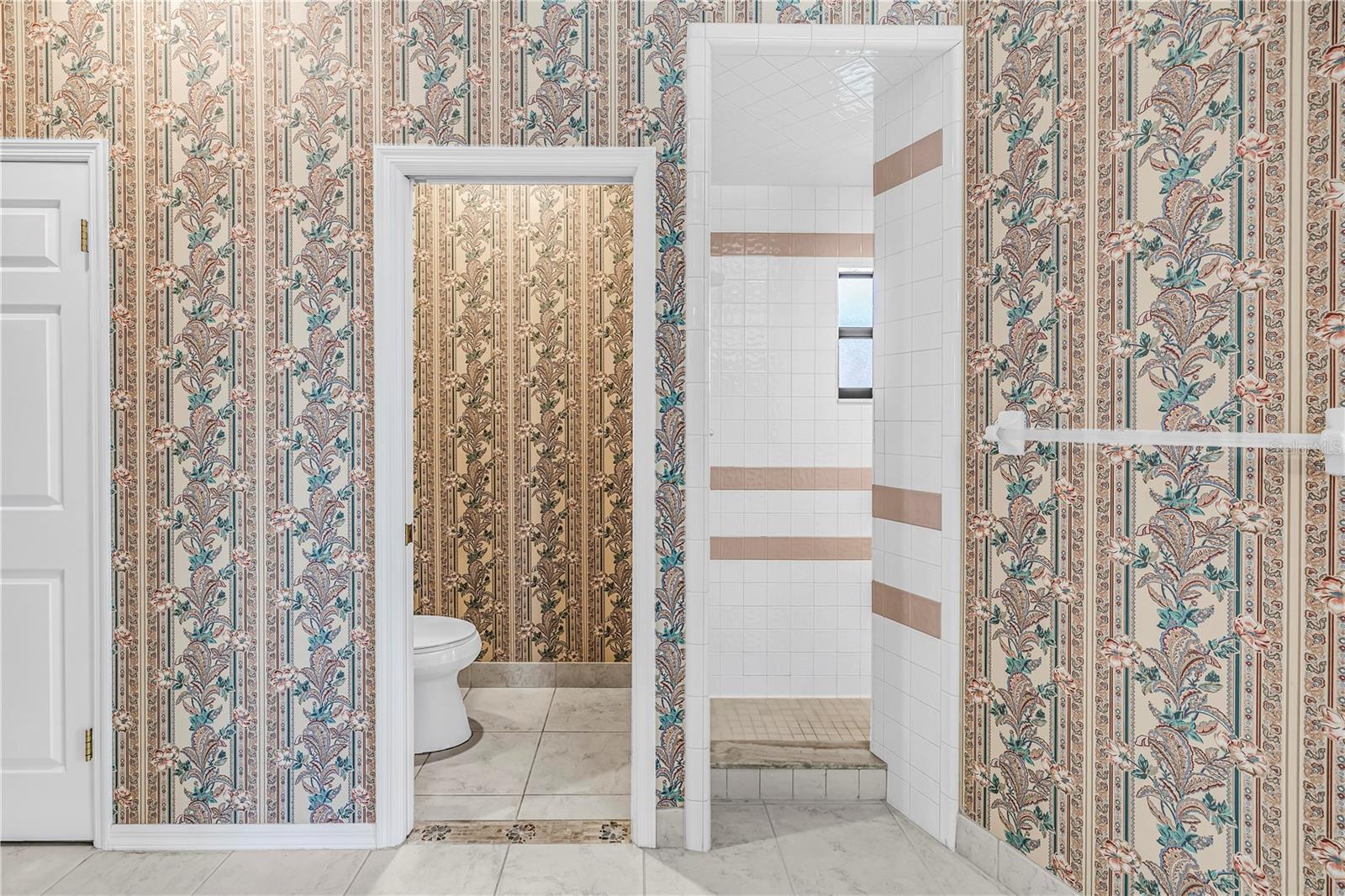 Private Toilet room and entry to enclosed shower. Towel Bar is on the outside wall of the shower.  SEE VIRTUAL RENDERING IN PHOTO 61
