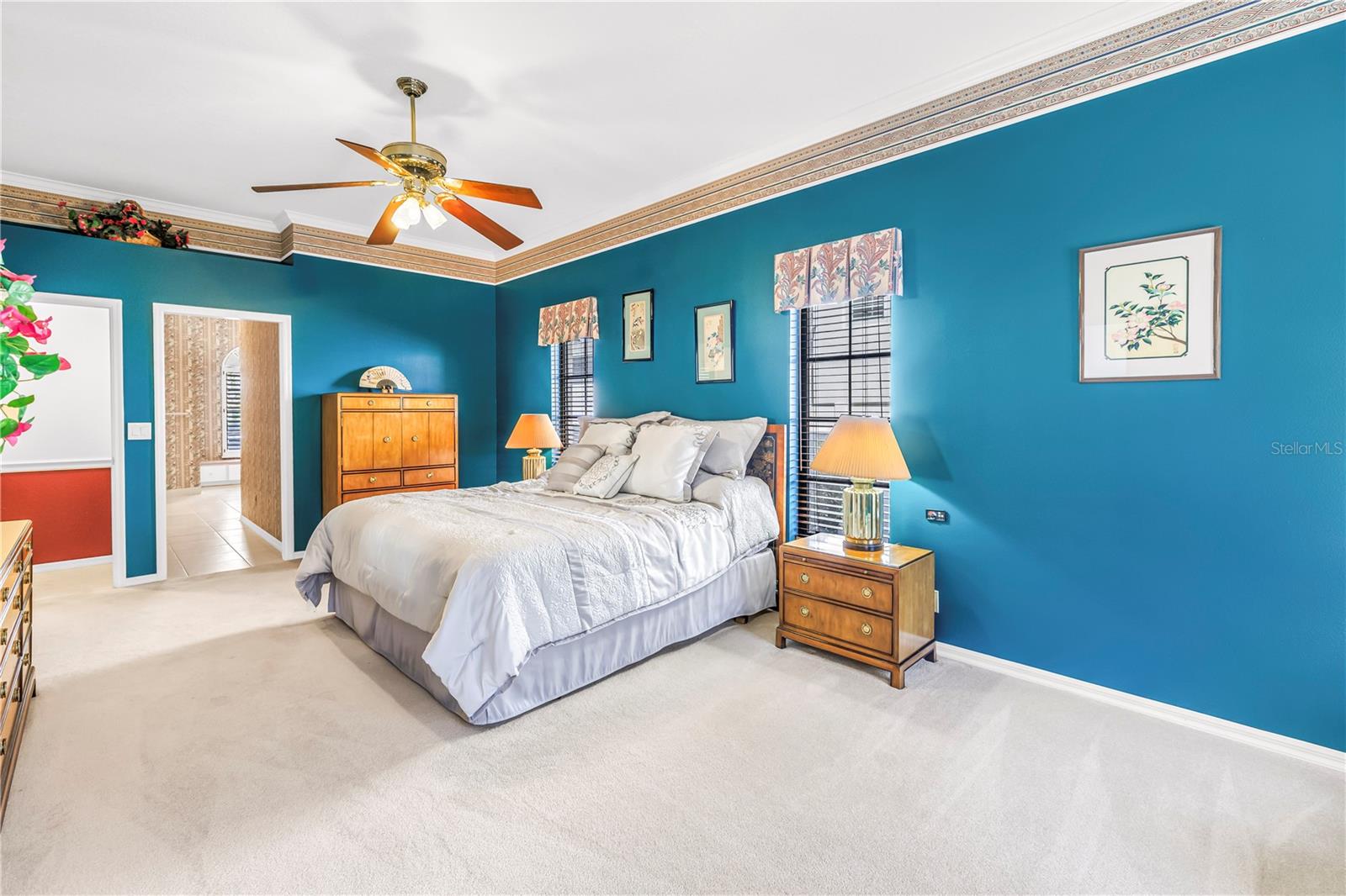 Primary Bedroom with doors to en suite bath and living room.  10 Foot Ceilings, windows and (2) 8-Foot sliders to the pool deck.  SEE VIRTUAL RENDERING IN PHOTO 61