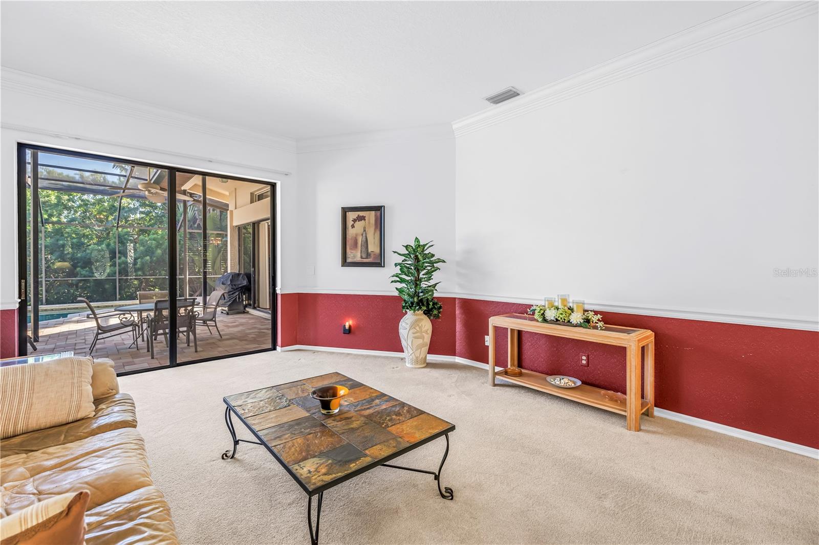 Crown molding and chair rail accent the 10-foot ceilings, creating a warm and welcoming entry to the home.