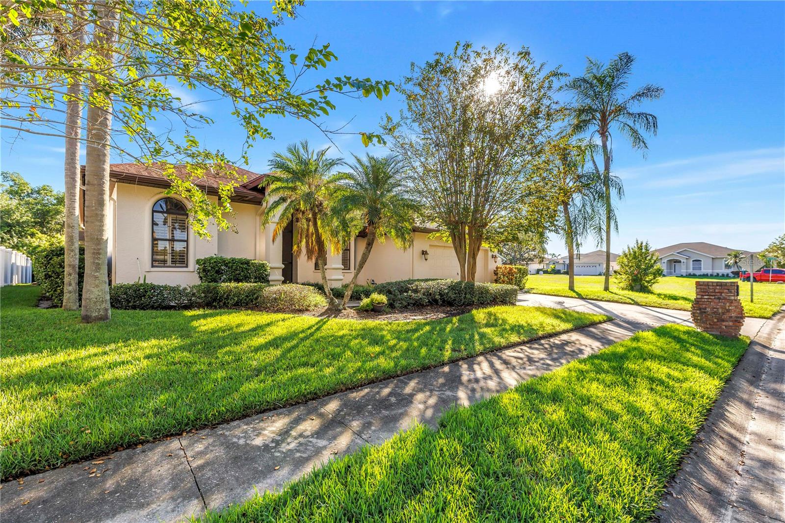 Charming exterior featuring sidewalks, a two-car driveway, and a two-car garage. Located in the beautiful Caya Costa nature preserve, perfect for safe, peaceful strolls at any time of day or night. Charming exterior featuring sidewalks, a two-car driveway, and a two-car garage. Located in the beautiful Caya Costa nature preserve, perfect for safe, peaceful strolls at any time of day or night.