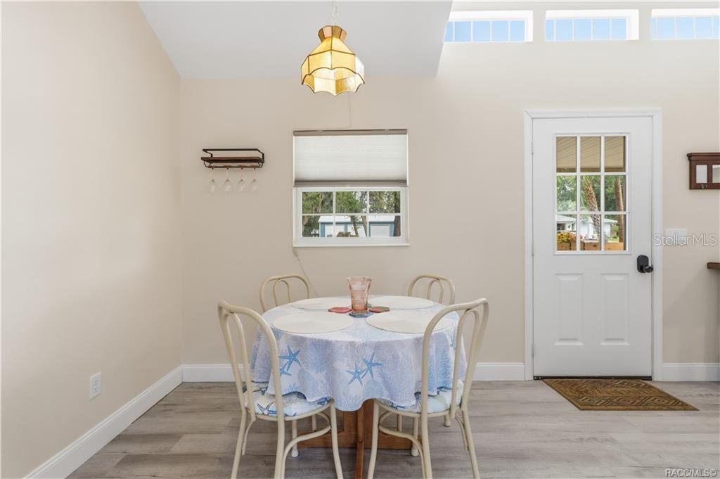 Dining Area  Comfortable dining space w/natural light, vaulted ceiling & convenient access to the kitchen & living area.