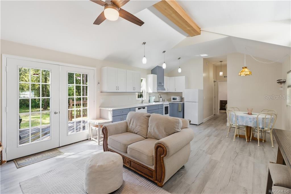 Open Kitchen & Living Space  VAULTED CEILINGS, pendant lighting, attractive cabinetry & an open design create a bright, comfortable gathering space.