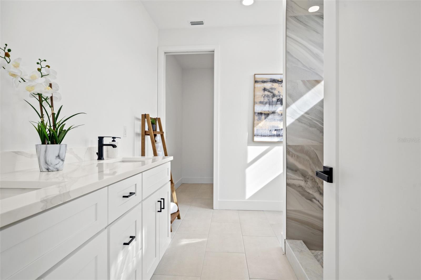 Bathroom vanity in a completed model residence