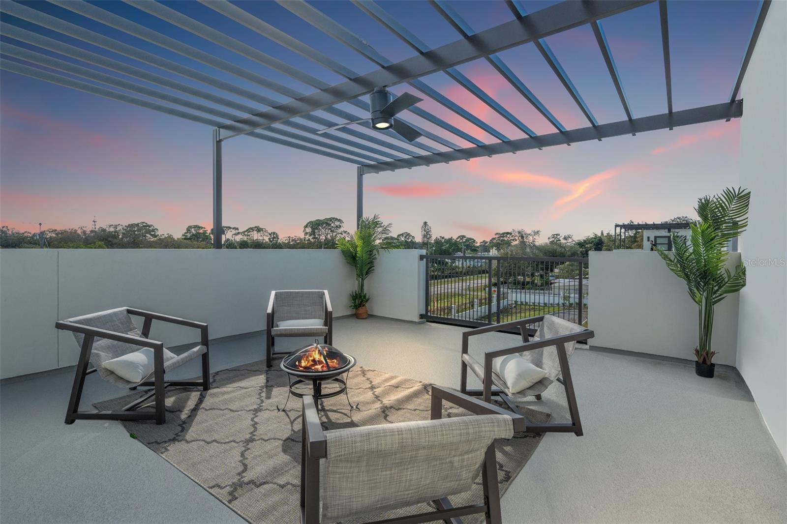 Rooftop terrace with pergola in a completed model residence (twilight enhanced)
