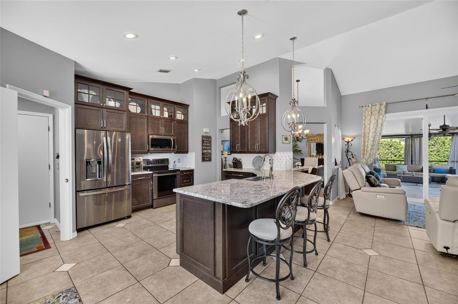 Kitchen showing door to laundry and garage