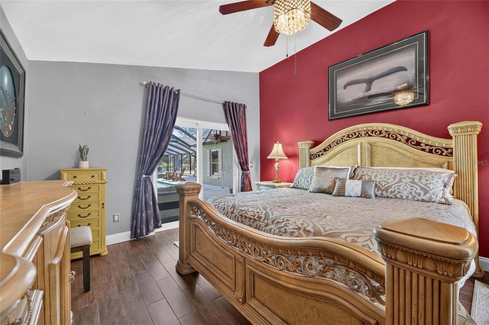 Master Bedroom showing sliders out to covered patio and pool