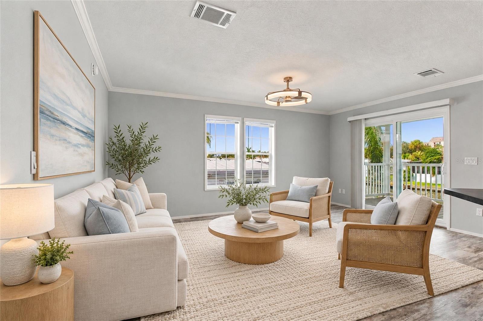 Open Living Room wth Sliders to back patio and water access