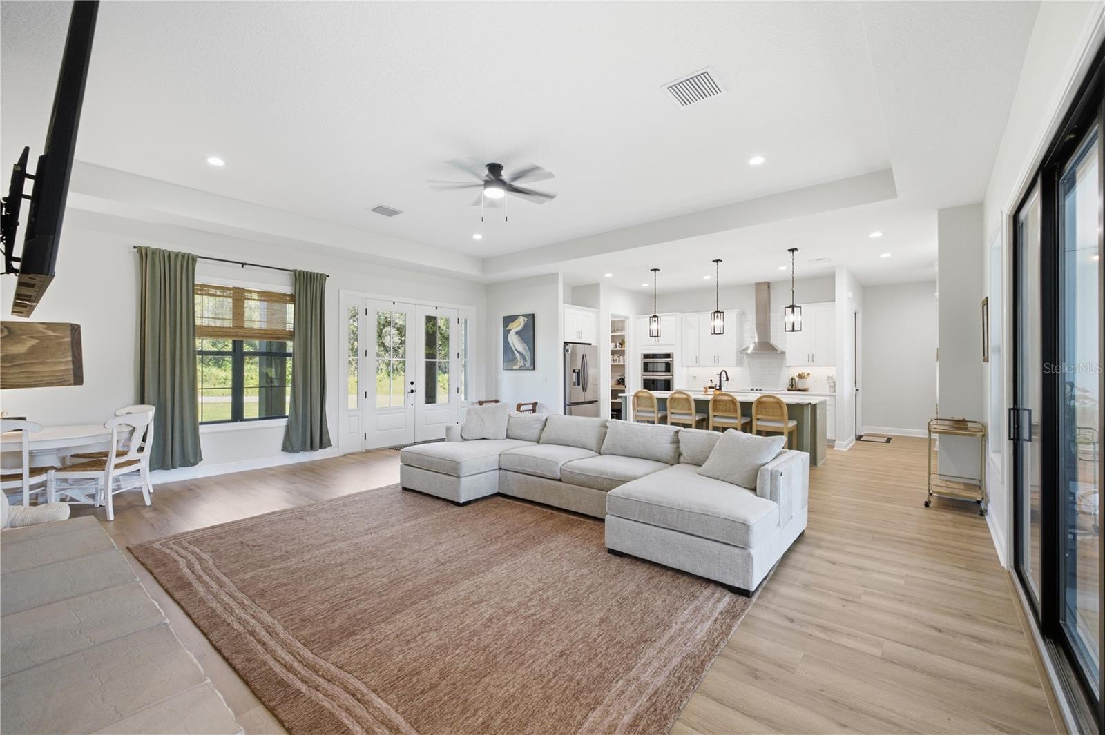 12 FT Tray Ceiling in the Great Room and Black Framed interior and exterior double pane windows.