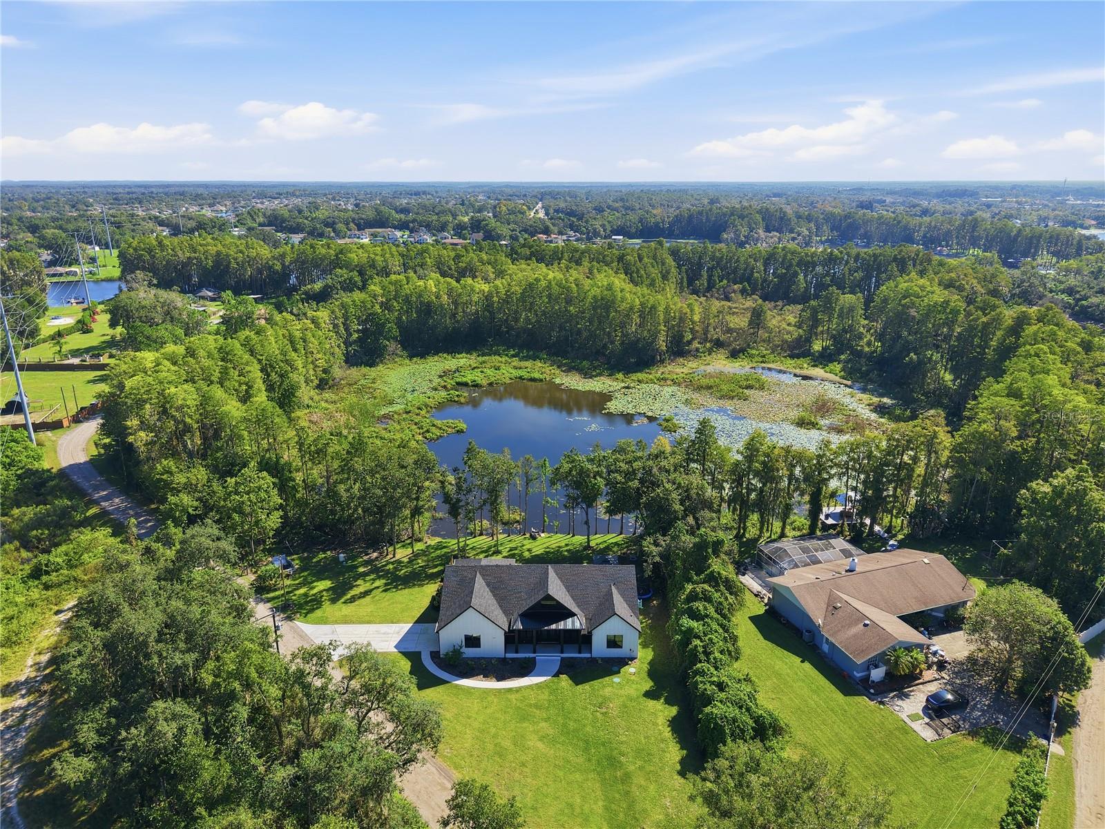 Sitting on 1.7 lakefront acres, tucked away in the heart of Land O Lakes Sitting on 1.7 lakefront acres, tucked away in the heart of Land O Lakes