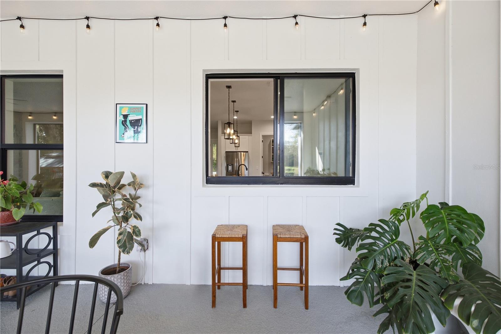 Pass through window from kitchen to rear porch for entertainment nad hosting.