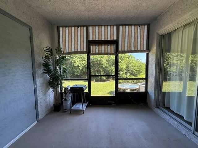 screened patio with canvas window covers. access from primary bedroom too