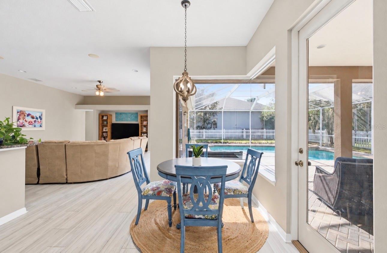 Kitchen breakfast nook with panoramic corner window.