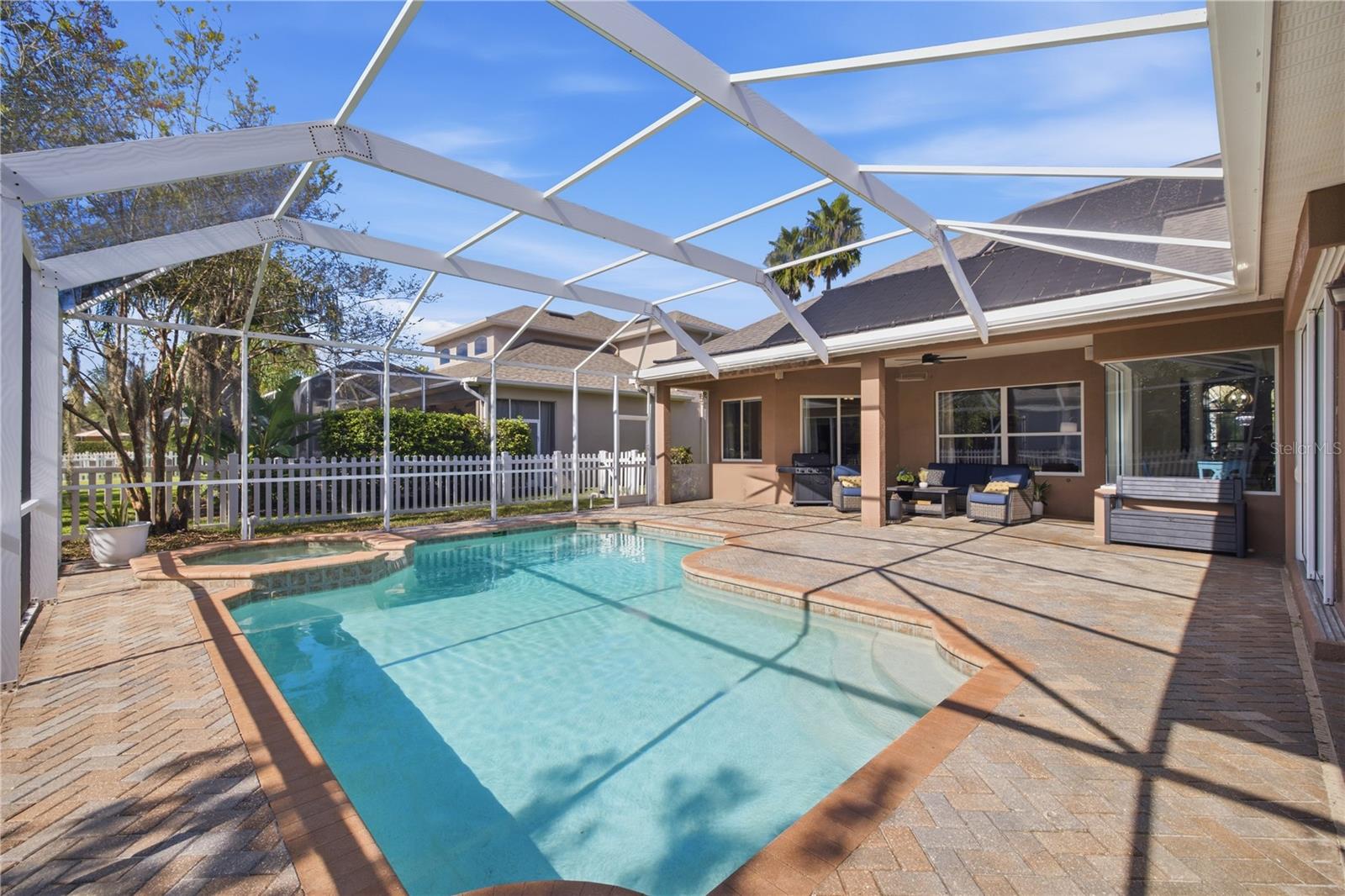 HEATED POOL AND SPA! Fully covered exterior and lanai with sitting area.
