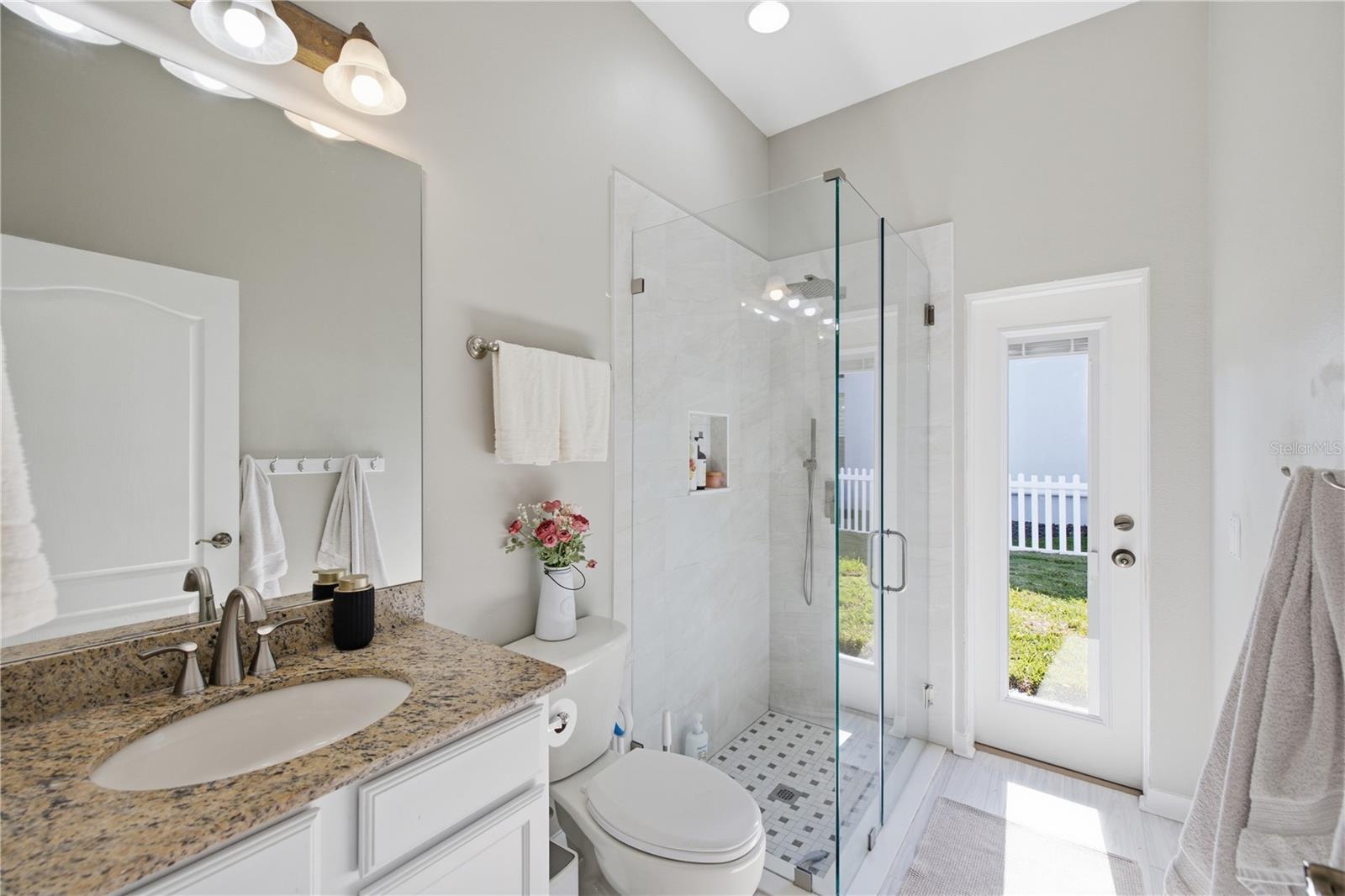Full Bath #3 at back of the home by bedroom #3 and bonus area. With rear entry for pool and play area to easily clean off.