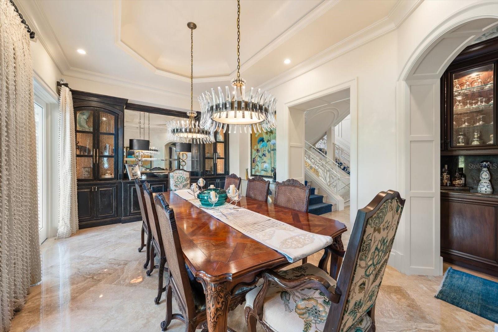 Illuminated Tray Ceiling, Statement Chandeliers & Arched Doorways