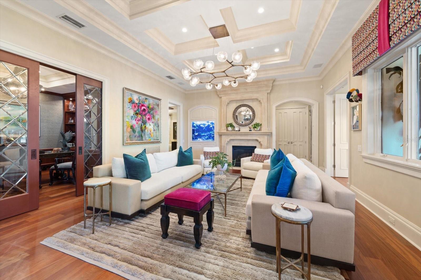 A gas fireplace with a precast stone mantel and a built-in saltwater aquarium in the formal living room A gas fireplace with a precast stone mantel and a built-in saltwater aquarium in the formal living room