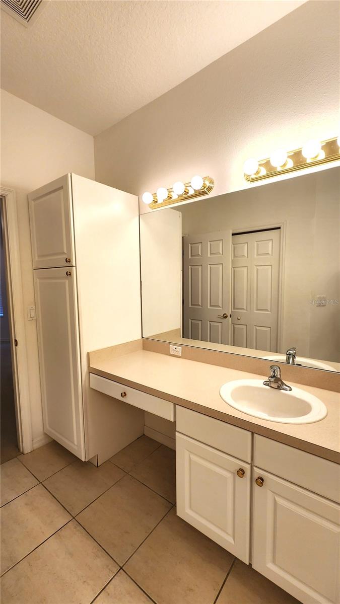 Primary Bathroom with Dual sinks and closet toilet.