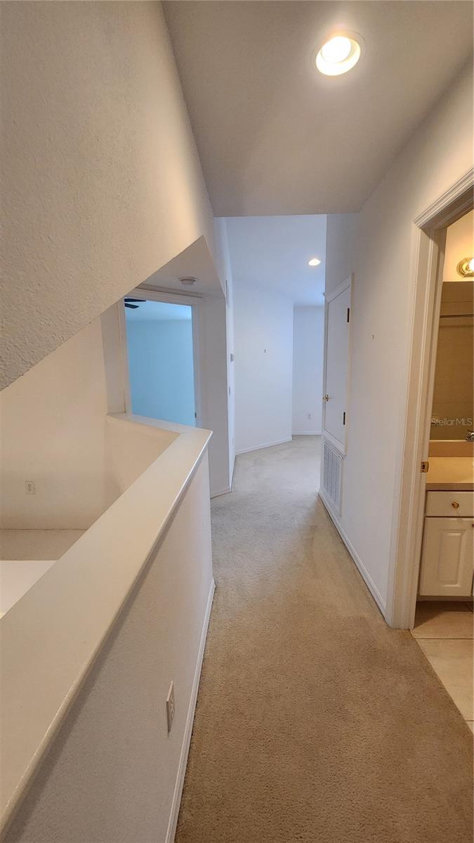 View from 3rd Bedroom into loft and guest bathroom.