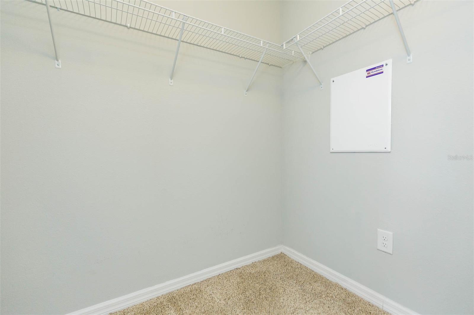 Primary Bedroom walk in closet