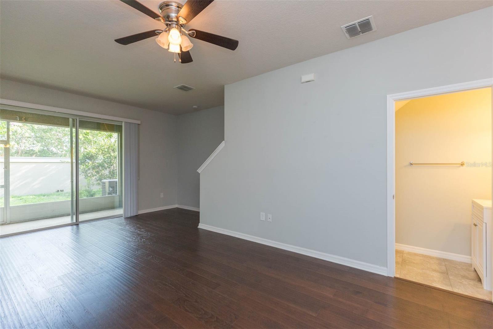 living room with view of half bath