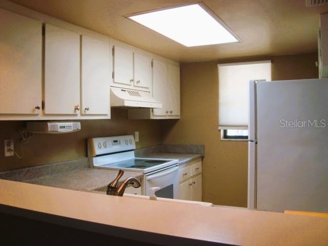 KITCHEN AREA/INSIDE STACKABE WASHER/DRYER KITCHEN AREA/INSIDE STACKABE WASHER/DRYER