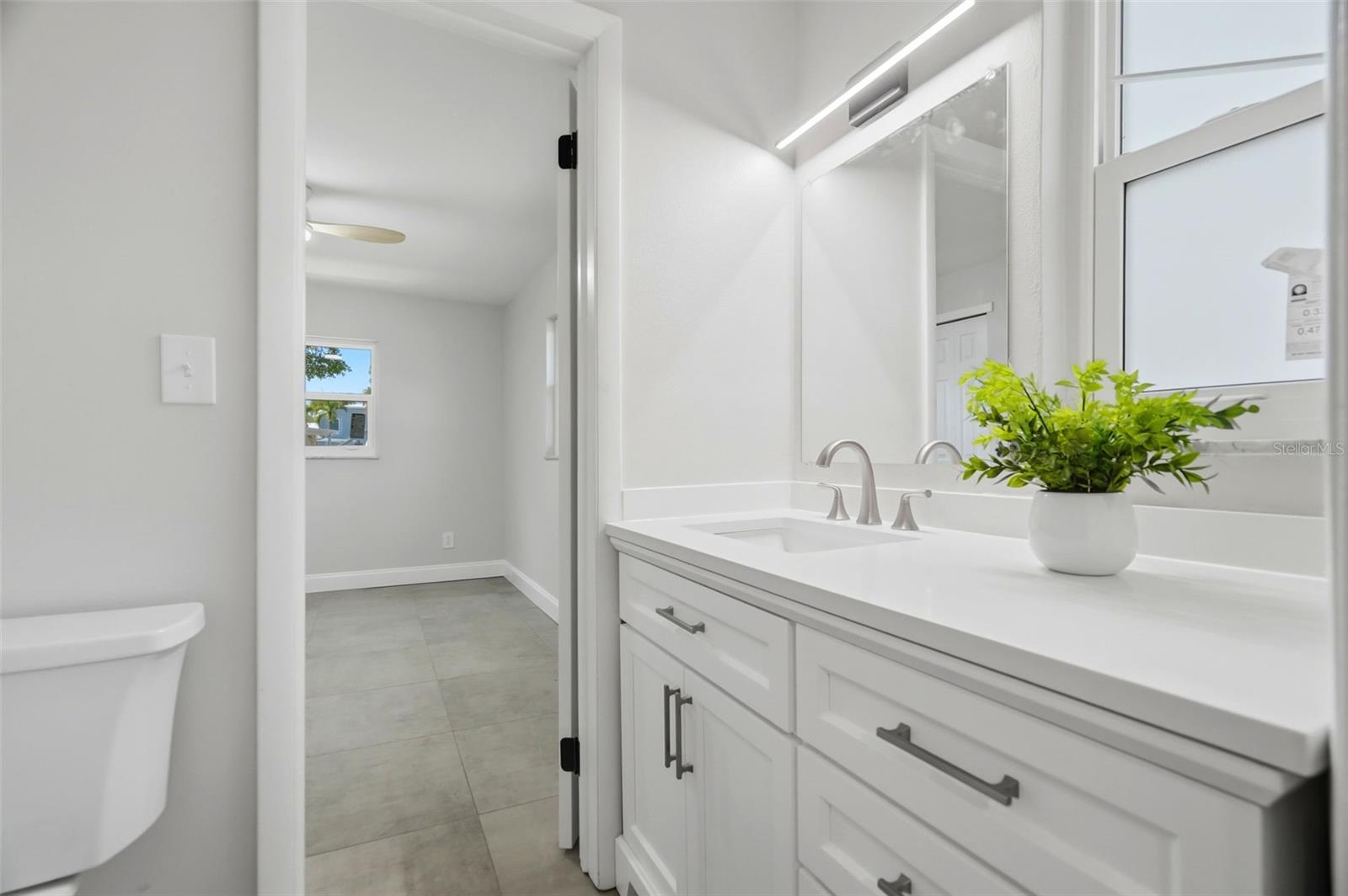 A convenient Jack-and-Jill bath connects two secondary bedrooms.