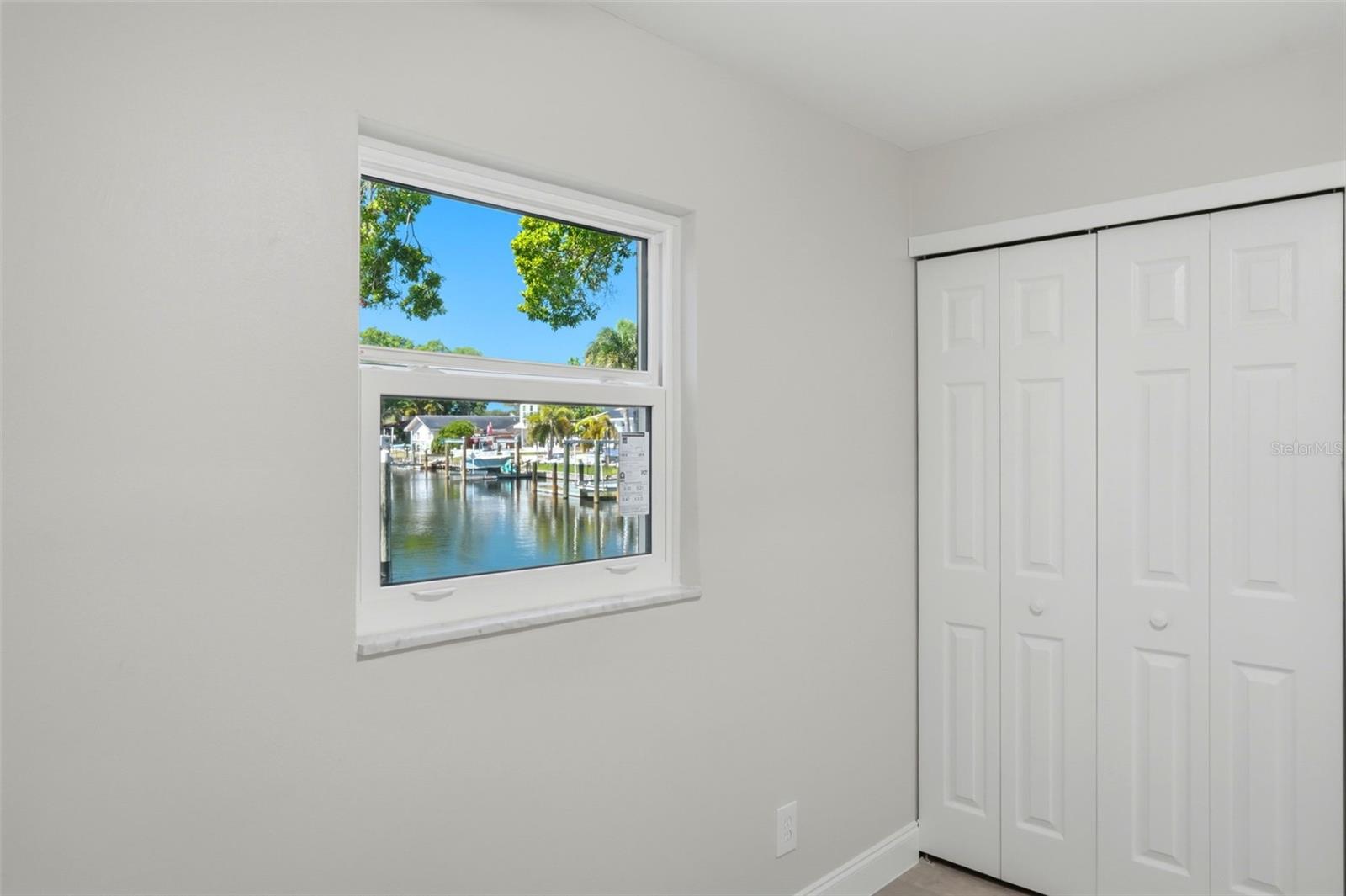 One of four bedrooms with a water view.