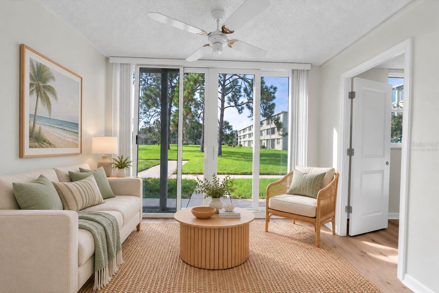 Virtually Staged: Florida Room Looking Towards massive courtyard with Pool.