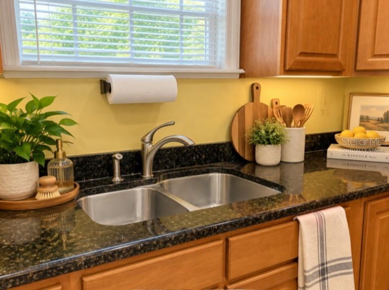 Virtually staged - there is no countertop decor.