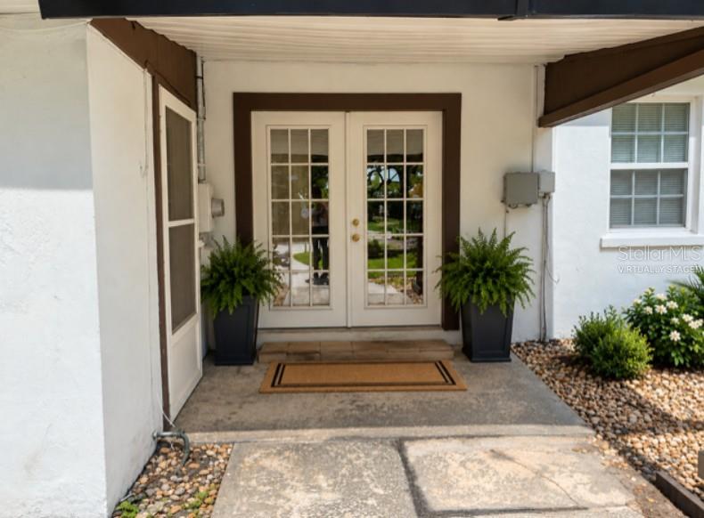 Back door - virtually staged (there are no potted plants)