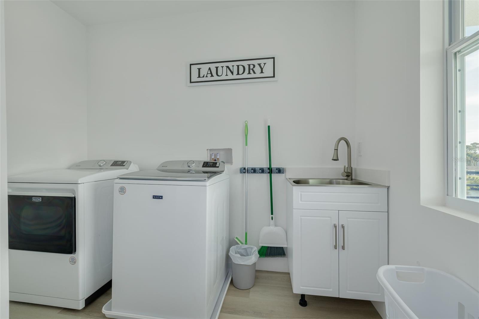 Laundry off loft area on the level with the three bedrooms.