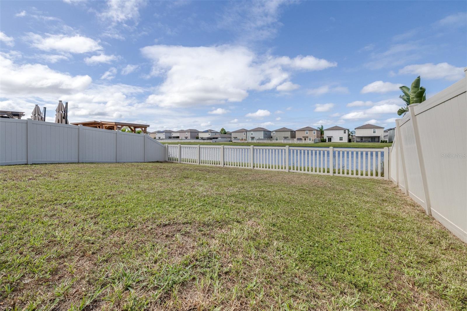 Fully Fenced yard overlooking pond