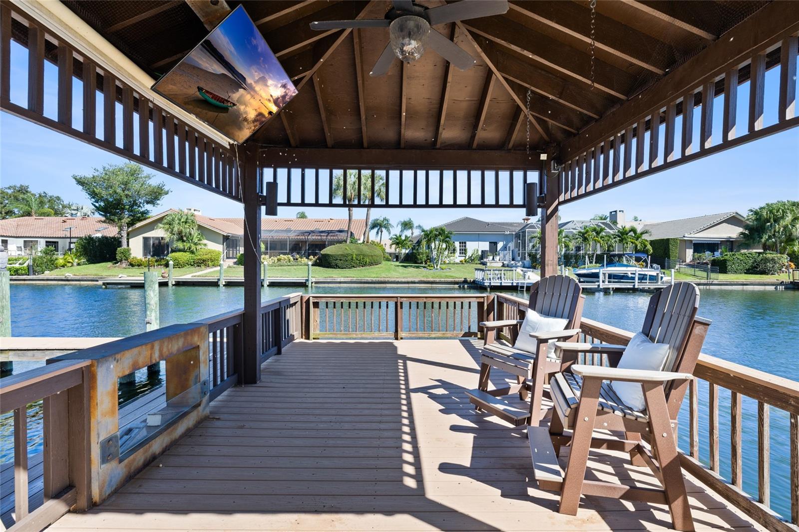 Covered dock space wth outdoor fireplace