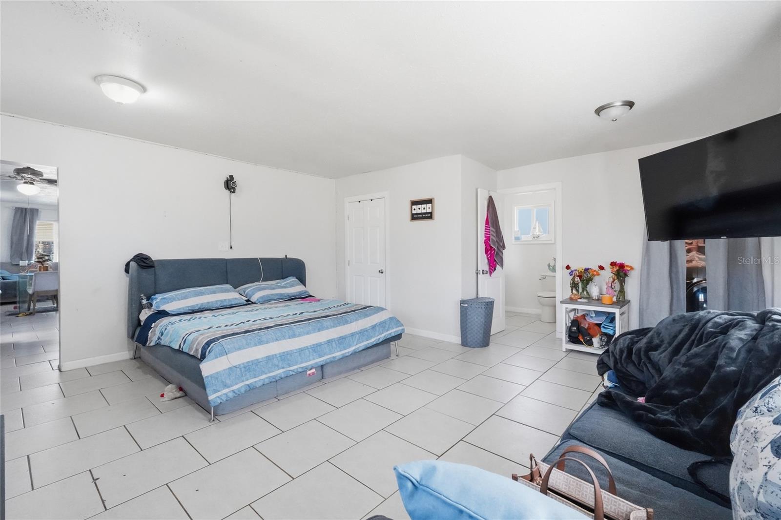 Primary bedroom 2420 with 1/2 bath and laundry